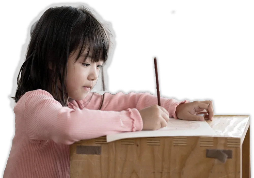Young student writing at a desk